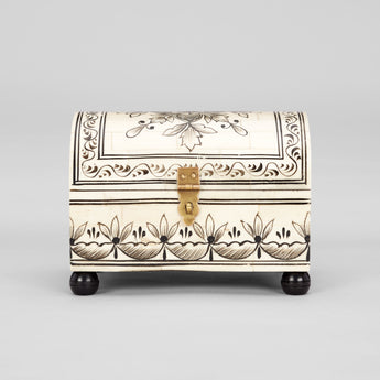 A SMALL BONE BOX WITH A DOMED LID, OVERALL PENWORK DECORATION AND NEW EBONISED BALL FEET.