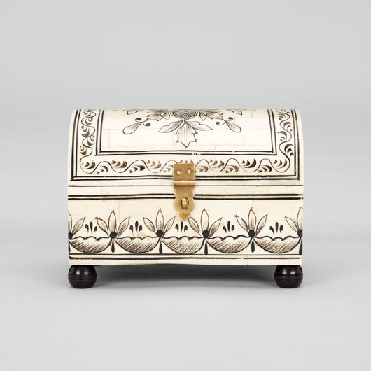 A SMALL BONE BOX WITH A DOMED LID, OVERALL PENWORK DECORATION AND NEW EBONISED BALL FEET.