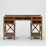 A 1950s BAMBOO FRAMED DESK WITH EBONISED RATTAN PANELS AND PAIRS OF DRAWERS SET ABOVE SHELVES.