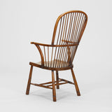 A LATE 19TH CENTURY OAK AND ELMWOOD WINDSOR CHAIR OF LARGE SCALE.