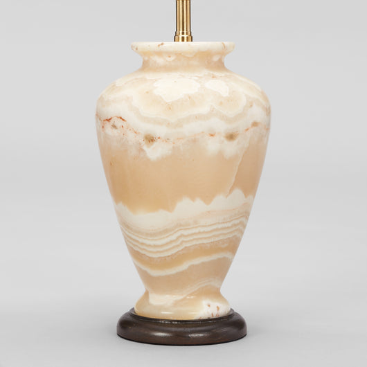 A SMALL ONYX INVERTED BALUSTER SHAPED BASE WIRED AS A LAMP.