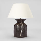A TURNED WOODEN NEPALESE TEKHI JAR WITH FLARED RIM AND OLD ALUMINIUM REPAIRS CIRCA 1970S, WIRED AS A LAMP.