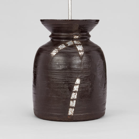 A TURNED WOODEN NEPALESE TEKHI JAR WITH FLARED RIM AND OLD ALUMINIUM REPAIRS CIRCA 1970S, WIRED AS A LAMP.