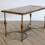 A 1960s/1970s SPANISH SIDE TABLE WITH A GILT METAL BASE AND LATER PAINTED DECORATION TO THE TOP.