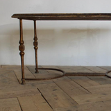 A 1960s/1970s SPANISH SIDE TABLE WITH A GILT METAL BASE AND LATER PAINTED DECORATION TO THE TOP.