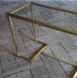 A 1970S ITALIAN BRASS CONSOLE TABLE WITH INSET GLASS TOP, IN THE MANNER OF WILLY RIZZO.