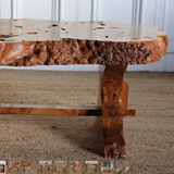 A MID-20TH CENTURY FRENCH COFFEE TABLE IN BURL WOOD.