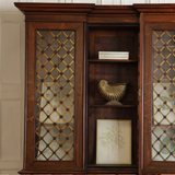 A VERY ELEGANT, 19TH CENTURY ENGLISH WILLIAM IV PERIOD INVERTED BREAKFRONT BOOKCASE IN ROSEWOOD, THE GLAZED DOORS WITH LATTICE AND ROSETTE BRASS GRILLS.