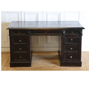 A GOOD QUALITY LATE NAPOLEON III, FRENCH PEDESTAL DESK, RETAINING THE ORIGINAL EBONISED FINISH, WITH NINE DRAWERS AND WITH ITS ORIGINAL TOOLED LEATHER TOP AND BRUSHING SLIDES. FRENCH, CIRCA 1880S