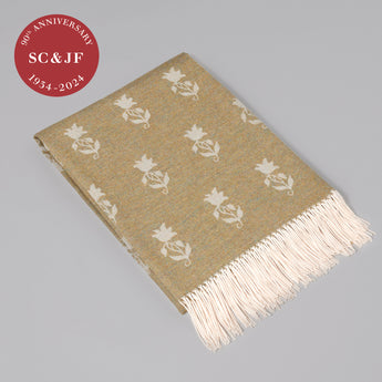 The 90th anniversary Berkeley Sprig lap rug woven in Scotland from 100% lambswool. Olive.