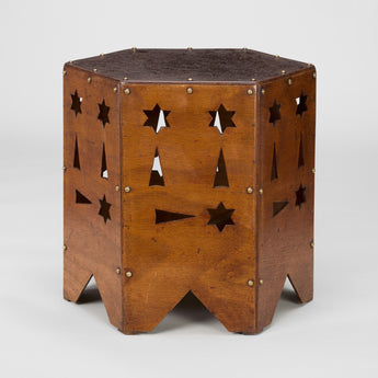 A SMALL LOW 1950s FRENCH HEXAGONAL TABLE WITH GEOMETRIC CUT-OUTS AND BRASS STUD DETAILING.