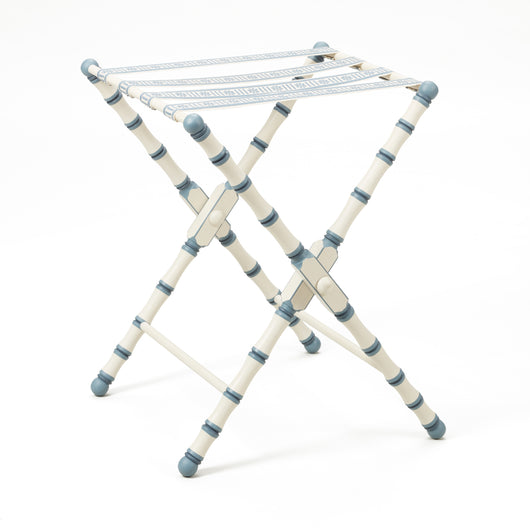 A HAND PAINTED TURNED WOODED LUGGAGE STAND (DESIGN DATING FROM THE 1950'S) FINISHED WITH A PATERAE BRAID.