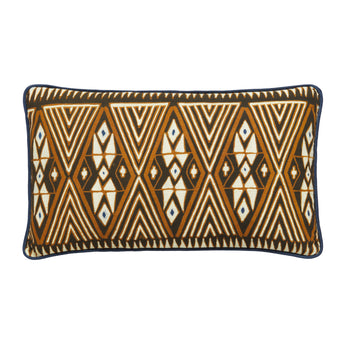 RECTANGULAR LUMBAR CUSHIONS MADE UP FROM A BATIK PANEL IN WHITES AND BROWNS ON A BLUE GROUND BACKED WITH A CHARTREUSE FABRIC.