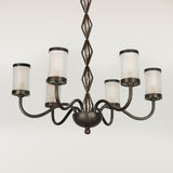 A mid-20th century continental wrought iron six-branch chandelier, the etched glass lampshades replaced.