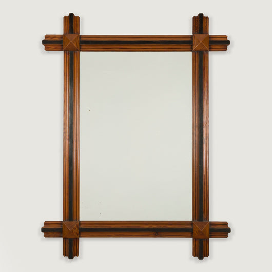 A rectangular pitch-pine framed mirror. French, late 19th century.