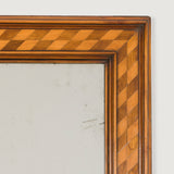 A late 19th century rectangular mirror, the walnut frame inlaid with marquetry banding.