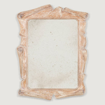 A rectangular mirror with an unusual mid-20th century asymmetrical limed carved oak frame.