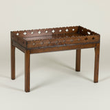 An early 19th century rectangular oak tray with open fretwork gallery, on a later stand.