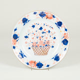 A 17th century Chinese Imari round charger depicting a basket of flowers within a floral border. Restored.