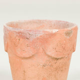 A set of ten miniature terracotta plant pots with scallop design to the rim.