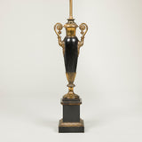 A pair of early 19th century French tole lamps, vase-shaped with brass mounts & handles, wired for electricity.