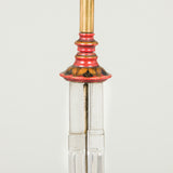 An unusual 1930s column lamp formed of four segmented glass columns set upon a round red lacquer base.