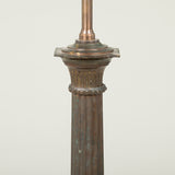 A late 19th or early 20th century bronzed metal column lamp (with slight old damage to fluted column).