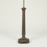 A late 19th or early 20th century bronzed metal column lamp (with slight old damage to fluted column).