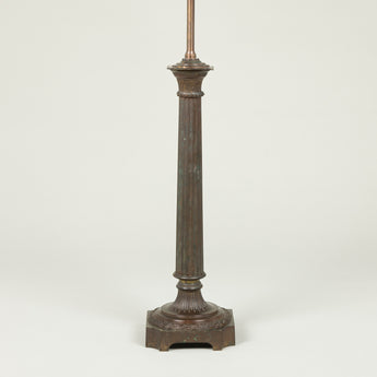 A late 19th or early 20th century bronzed metal column lamp (with slight old damage to fluted column).
