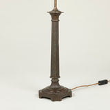 A late 19th or early 20th century bronzed metal column lamp (with slight old damage to fluted column).