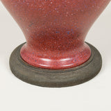 A small baluster shaped pottery vase with a painted faux porphyry finish, wired as a lamp.