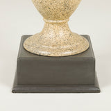 A painted metal vase lamp with a faux stone finish on a square wooden base. 20th century.