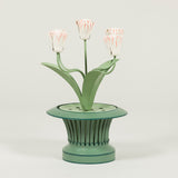 A tole painted tulip candelabra, after an original found in Paris by John Fowler in the 1950's.