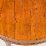 A pair of fruit-wood veneered demi-lune side tables with square tapered legs. Italian, circa 1800.