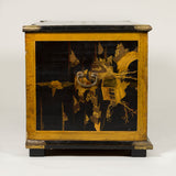 An 18th or 19th century Japanese lacquer coffer made from earlier lacquer panels, with engraved brass mounts.