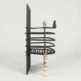 A late 19th century English wrought iron and brass fire grate in the Dutch style. Circa 1890.