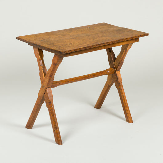 A provincial elm occasional table, late 19th/early 20th century, on x-frame supports.