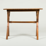 A provincial elm occasional table, late 19th/early 20th century, on x-frame supports.