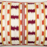A pair of rectangular cushions made up in a red and white ikat stripe.