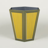 A hexagonal waste paper bin with hand painted faux panel decoration. Paint chart colour No. 7.