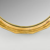 A round convex mirror with facetted giltwood frame. 20th century.
