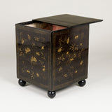 A square Chinese export lacquer box. Sliding lid and gilt decoration. Early 19th century, later ball feet.
