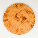 A round bamboo table with a veneered top and folding base. 20th century.