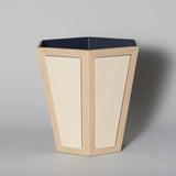 A hexagonal waste paper bin with hand painted faux panel decoration. Paint chart colour No. 10.
