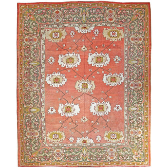 AN ANTIQUE USHAK CARPET CIRCA 1880 WITH AN OPEN FLORAL PALMETTE DESIGN ON A SOFT APRICOT GROUND.