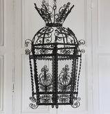 AN EARLY 20TH CENTURY HEXAGONAL SPANISH LANTERN IN FINE METAL SCROLL-WORK.