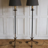 A PAIR OF 1950s SPANISH LEATHER MOUNTED FLOOR LAMPS, REWIRED.