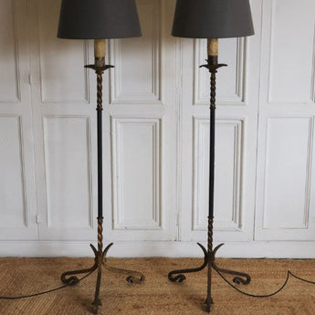 A PAIR OF 1950s SPANISH LEATHER MOUNTED FLOOR LAMPS, REWIRED.