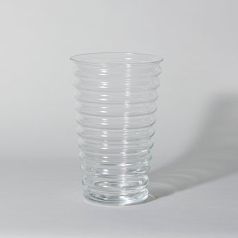 A tall early 20th C. clear glass vase of ribbed form. English, circa 1930.