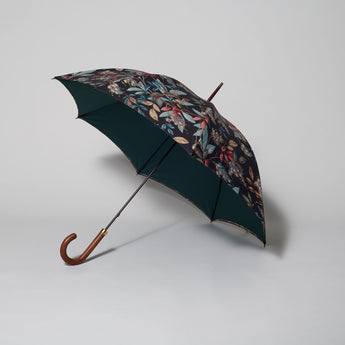 A Sibyl Colefax & John Fowler Indian Fuchsia double canopy umbrella with a green contrast linen, a dark grained hardwood handle and a gilt collar engraved with SC&JF.